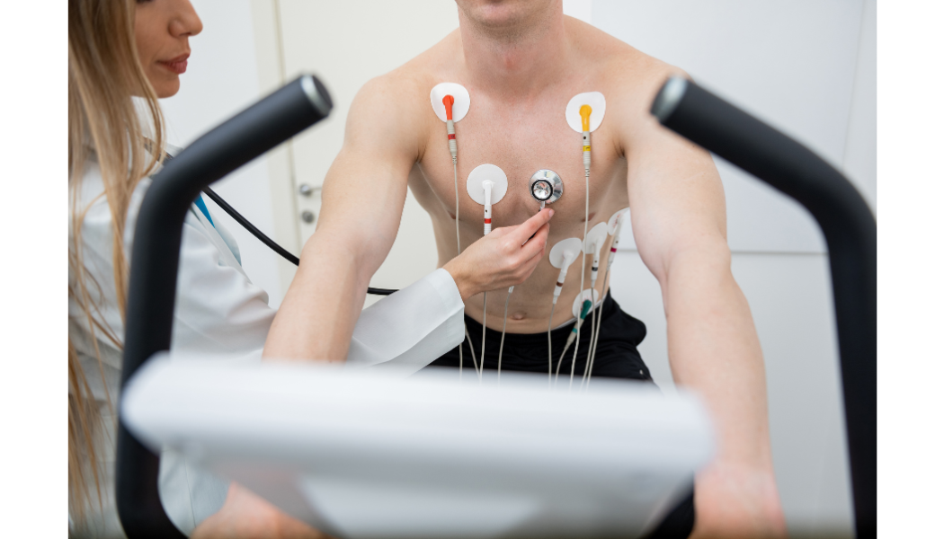 Patient exercising with electrocardiogram electrodes attached.
