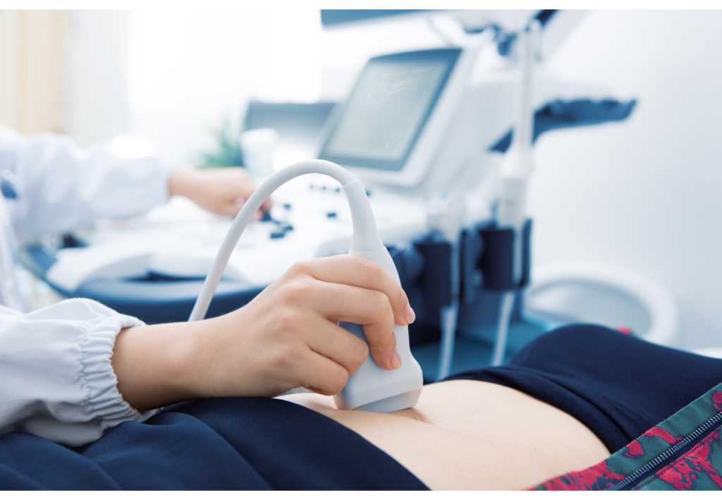 Clinician using an ultrasound probe during an examination.