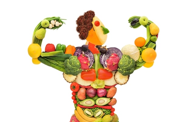 Person-shaped arrangement of fruits and vegetables.